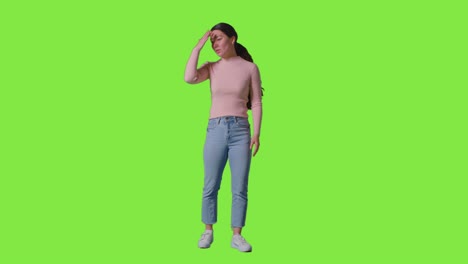 Full-Length-Studio-Portrait-Of-Frustrated-Angry-Woman-Shouting-Off-Camera-Standing-Against-Green-Screen-1